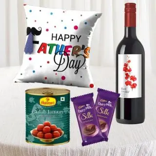 Bottle of wine with photo cushion , 1 kg gulab jamun, 2 dairy milk silk chocolates 