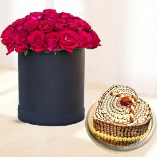 Box arrangement of 50 red roses with heart shape butterscotch cool cake 