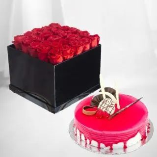 Box arrangement of 50 red roses with strawberry cool cake 