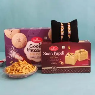box of cookies, half kg soan papdi, 200 grams mixture with 2 rakhis 