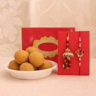 Box of half kg besan laddoo with set of 2 rakhi for bhaiya bhabhi 