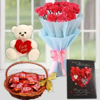 Bunch of10 pink carnations, basket of kit kat chocolates , 6 inch white teddy bear, greeting card 