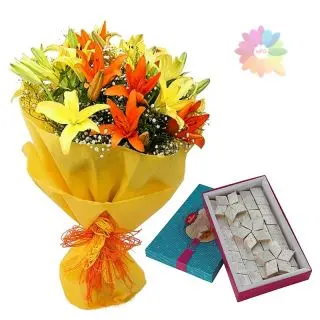 bunch of 10 yellow and orange lilies with Half kg kaju katli