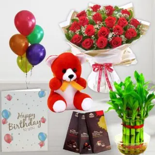Bunch of 15 red roses, set of 3 bournville chocolates, 6 inch height teddybear , 2 layer Lucky bamboo plant ,5 blown balloons with birthday greeting card