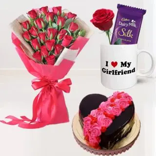 Bunch of 20 red roses , 1 kg heart shape floral theme chocolate cake, white mug with silk chocolate and single red rose 