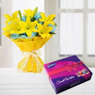 Bunch of 8 yellow lilies with box of celebration chocolates 