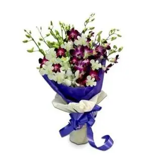 Exotic hand bouquet of lavender and white orchids mix together