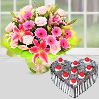 Bunch of lilies, roses and gerberas in mixed colour with heart shape  black forest cake 