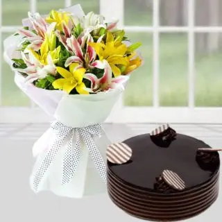 Bunch of mix lilies with  chocolate cake 