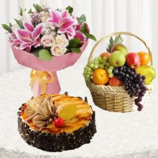 Bunch of mix exotic flowers with half kg irish chocolate cake with basket of 2 kg assorted fruits