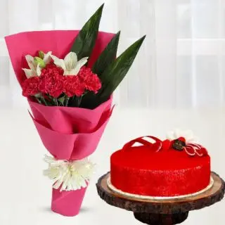 Bunch of red carnation with white lilies with red velvet premium quality cool cake 