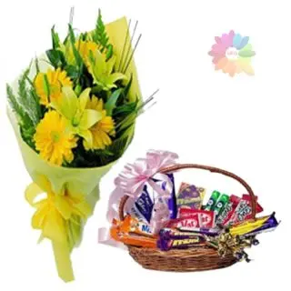 Bunch of yellow lilies and yellow gerberas with Beautiful basket of assorted chocolates 