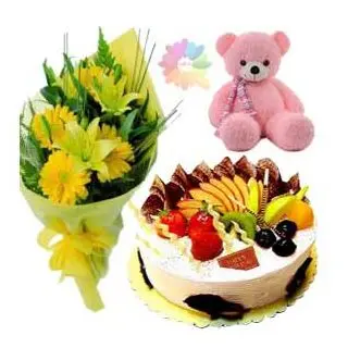 Bunch of yellow lilies & gerberas with mix fruit fresh cream cake & 1 feet height pink colour teddy bear
