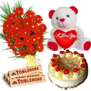 20 red roses bunch with 2 pcs of toblerone, 8 inch teddy with 1 pound fresh cream pineapple cake