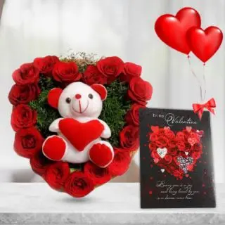 cute 6 inch teddybear sitting in heart shape arrangement of 20 red roses with pair of 2 heart shape balloons 