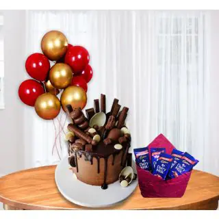 Delicious chocolate explosion cake with bunch of 5 blown balloons with pack of 5 dairy milk chocolates   