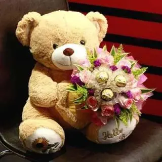 Delighful paradise-2 feet height teddy bear with 12 pcs ferrero rocher chocolates mix with floral arrangement