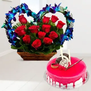 Exclusive basket arrangement of blue orchids with red roses with strawberry cool cake  