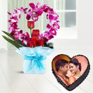 Exclusive Vase arrangement of lavender orchids with red roses with heart shape photo cake in chocolate flavour 