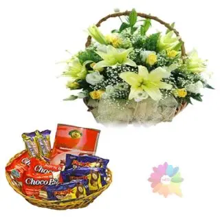 Exotic basket arrangement of lilies and roses with basket of assoted chocolates