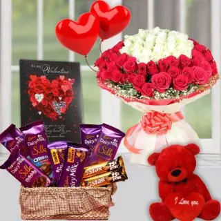 Exotic Bunch of 50 red and white roses, basket of 7 dairy milk silk with two 5 star chocolates, pair of heart shape balloons, valentine day card, and 6 inch red teddybear 