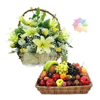 Exotic lilies and roses basket arrangement with 5 kg seasonal fruits basket 