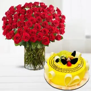Exotic vase arrangement of 150 red roses with pineapple cool cake 