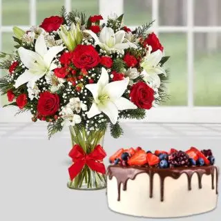 Exotic vase arrangement of lilies with roses with choco strawberry cool cake 