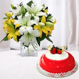 Exotic vase arrangement of mix colour lilies with strawberry cake 