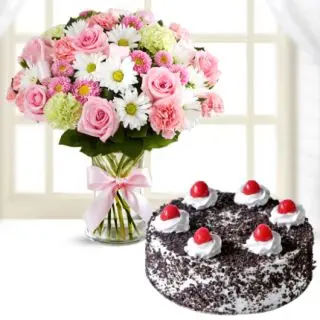 Exotic vase arrangement of mix flowers with roses, gerberas, carnations & black forest cool cake 