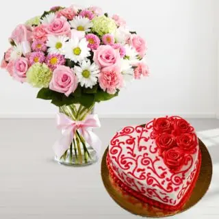 Exotic vase arrangement of roses and gerberas with heart shape floral theme red velvet cake 