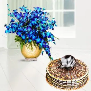 Exotic vase arrangement of 20 blue orchids with premium quality butterscotch cool cake 