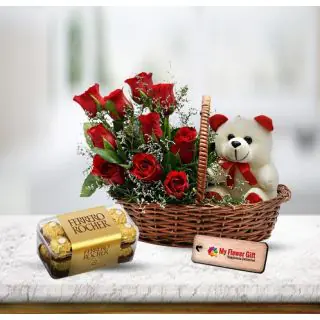  Beautiful arrangement of 10 red roses with a cute teddybear sitting in it , with 16 pcs rocher ferrero chocolates 