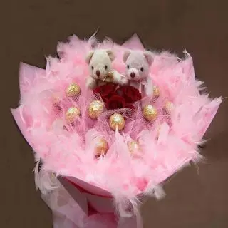 From Heart- Designer chocolate bouquet of 16 pcs ferrero rocher  with 2 teddy bear sitting on it