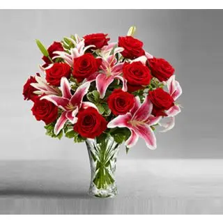 Gracious  Beauty- 12 red roses arranged with 5 pink lilies in glass vase 