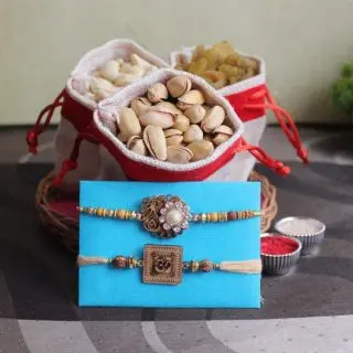 Half kg assorted dry fruits with set of 2 rakhis and roli chawal  