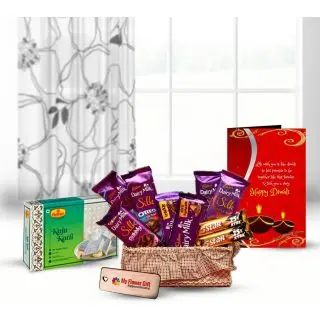 Kaju Katli sweets, Basket of dairy milk silk & Five star  chocolates with Diwali greeting card