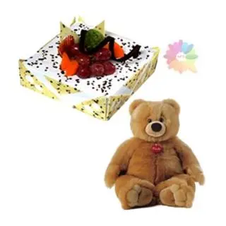 pineapple fresh cream cake with exotic fruits topping with 2 feet height teddy bear