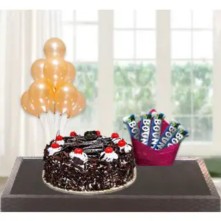 premium quality black forest cake with pack of 5 bounty chocolates with bunch of 5 blown balloons 