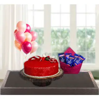  red velvet cake with bunch of 5 blown balloons with pack of 5 dairy milk chocolates 