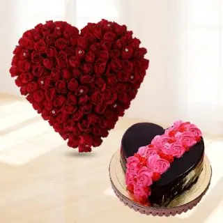 Heart shape arrangement of 50 red roses with 1 kg heart shape chocolate cake with floral topping 