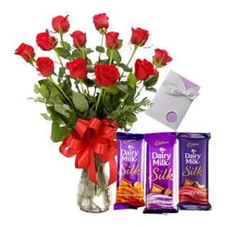 Heartfelt emotions-12 red roses arranged in glass vase with 3 dairy milk silk with greeting card