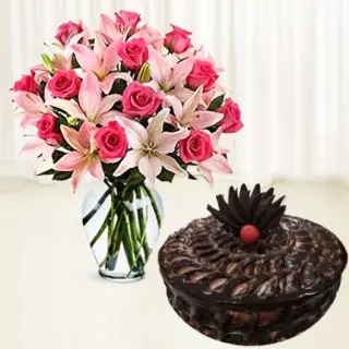 Lilies and roses vase arrangement with chocolate fudge cake