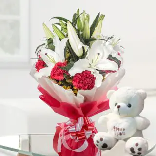 bunch of white lilies with red carnation with 6 inch white teddy bear