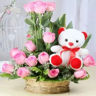 Cutie Pie .. A cute Pink Teddy bear along with beautiful arrangement of mix flowers