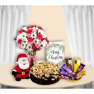 Mix Flowers arranged in glass vase , santa Soft toy, christmas greeting card, Cashew plum cake with basket of assorted chocolates