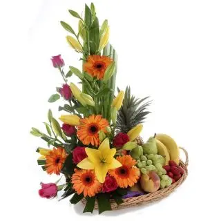 fruits basket with mixture of roses, lilies