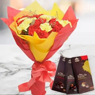 Bunch of 20 red and yellow carnations with set of 3 bournville dark chocolates 