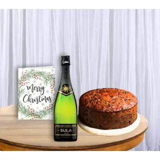 Plum Cake with bottle of wine with christmas greeting card 