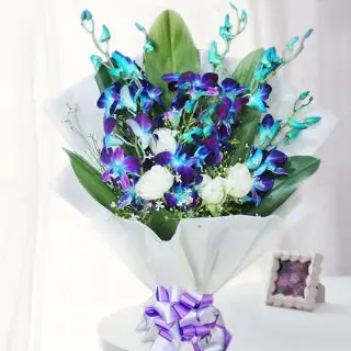 Blue Orchids and white carnations Arrangement